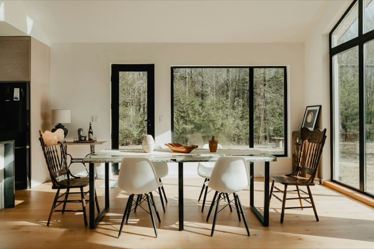 A dining room with a table and chairs