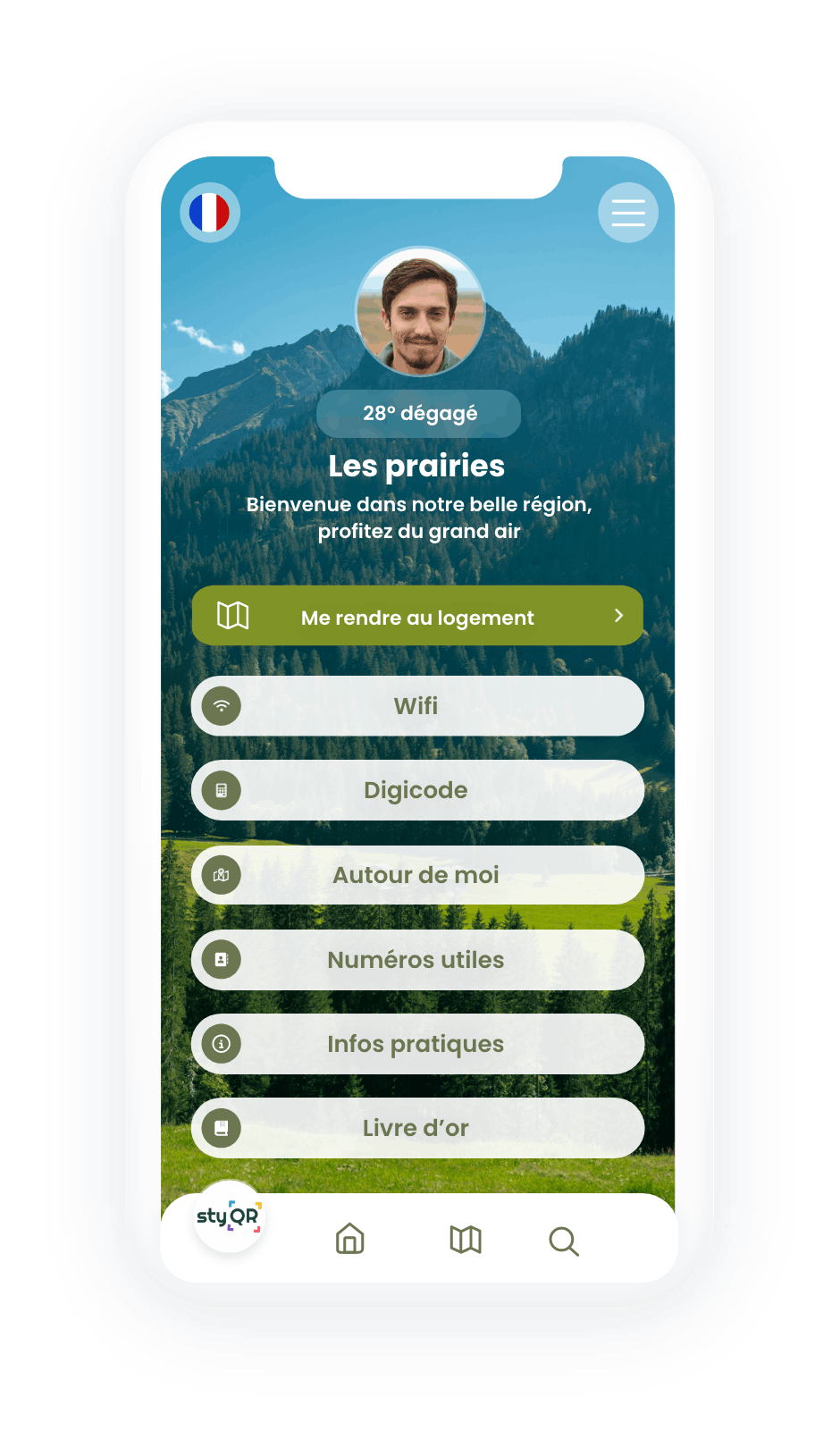 Smartphone affichant un livret d&rsquo;accueil digital avec une montagne en fond